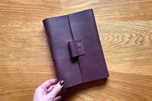 A5 portrait leather journal or notebook bound by hand in Maroon and Magenta