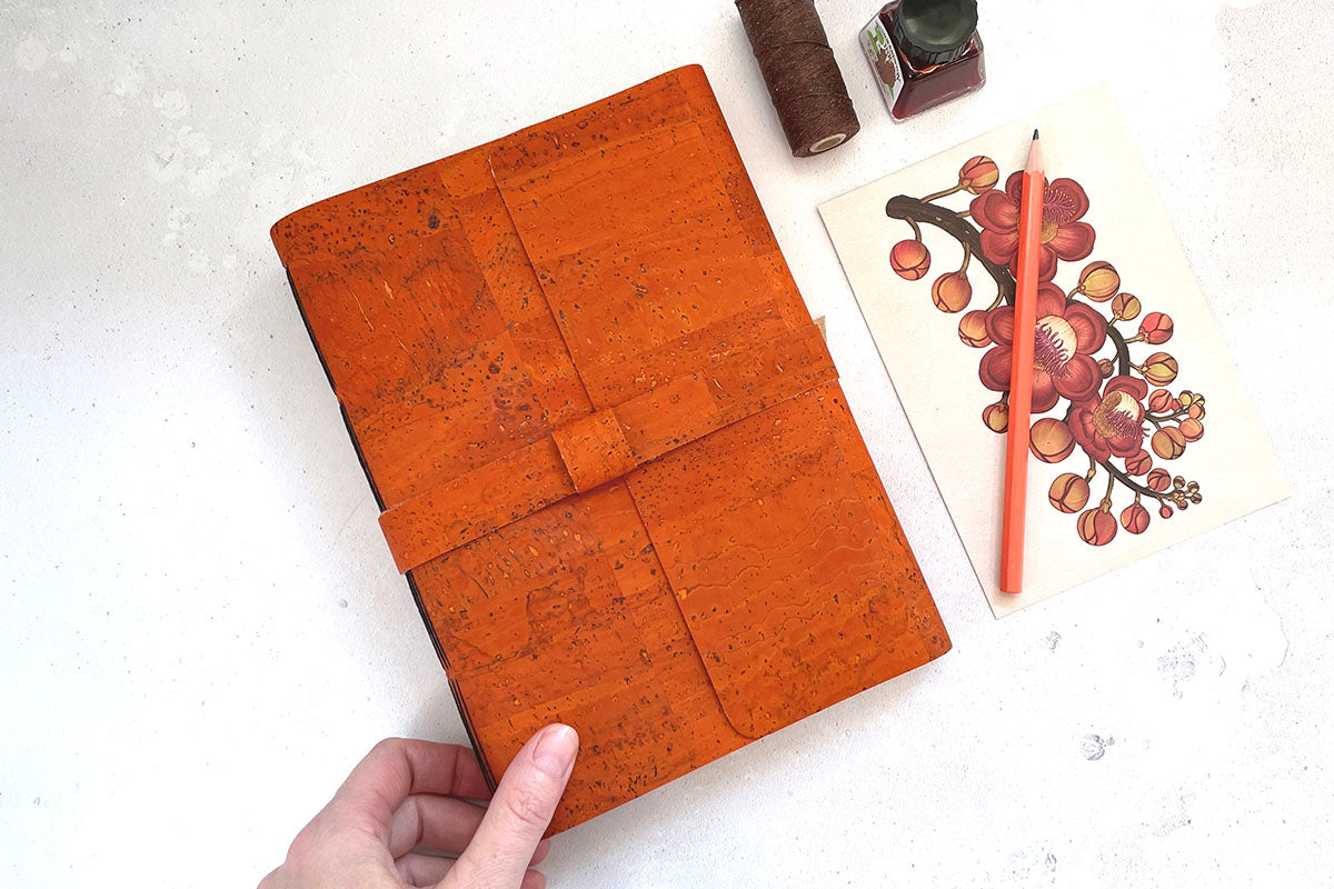 Softcover vegan sketchbook bound by hand in recycled, sustainable natural materials.