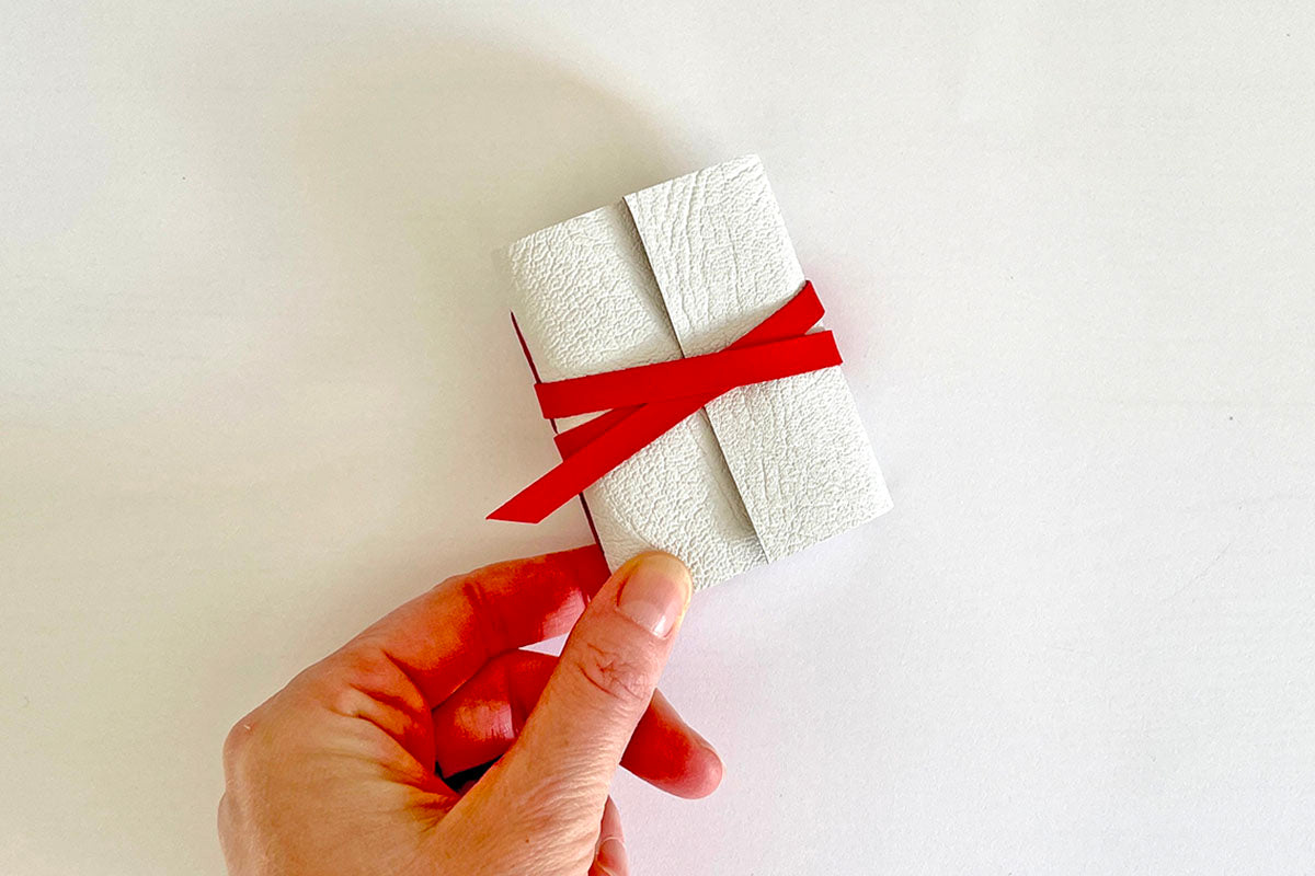 Little notebook stationery gift bound in festive white and red leather