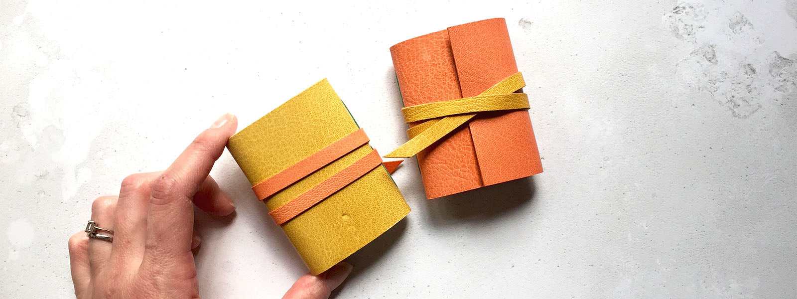 Miniature Journals bound in peach and yellow leather, a little notebook desk accessory stationery gift handmade in the UK