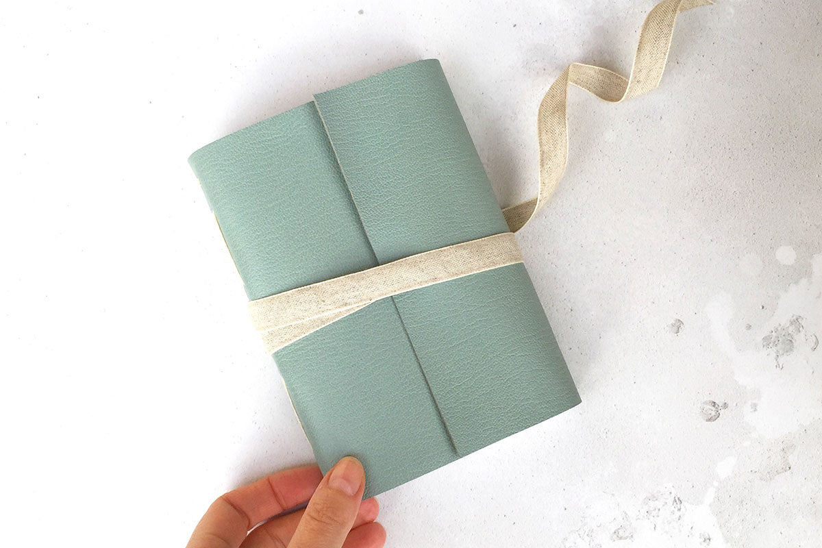 A6 small Leather Sketchbook or Notebook with linen ribbon, bound in Duck Egg Longstitch style.