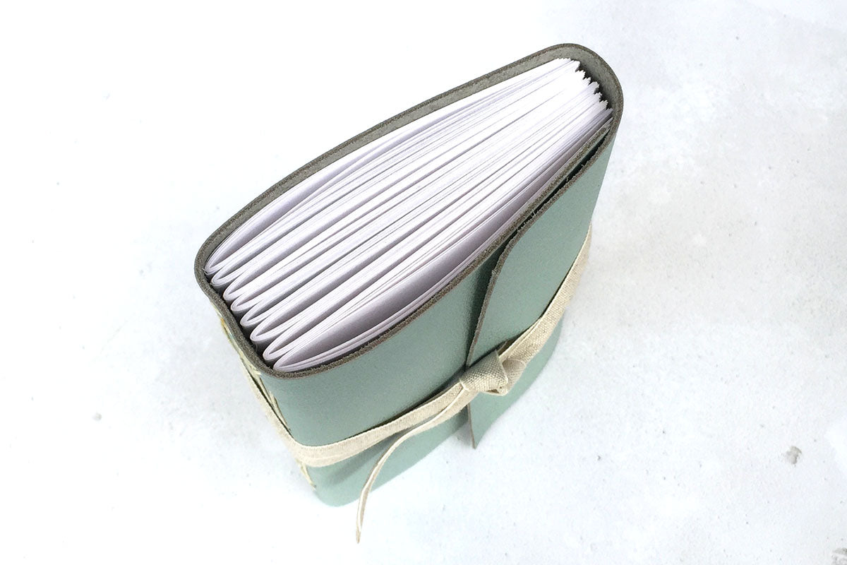 Leather Sketchbook or Notebook with hand stitched pages, bound in leather with linen ribbon.