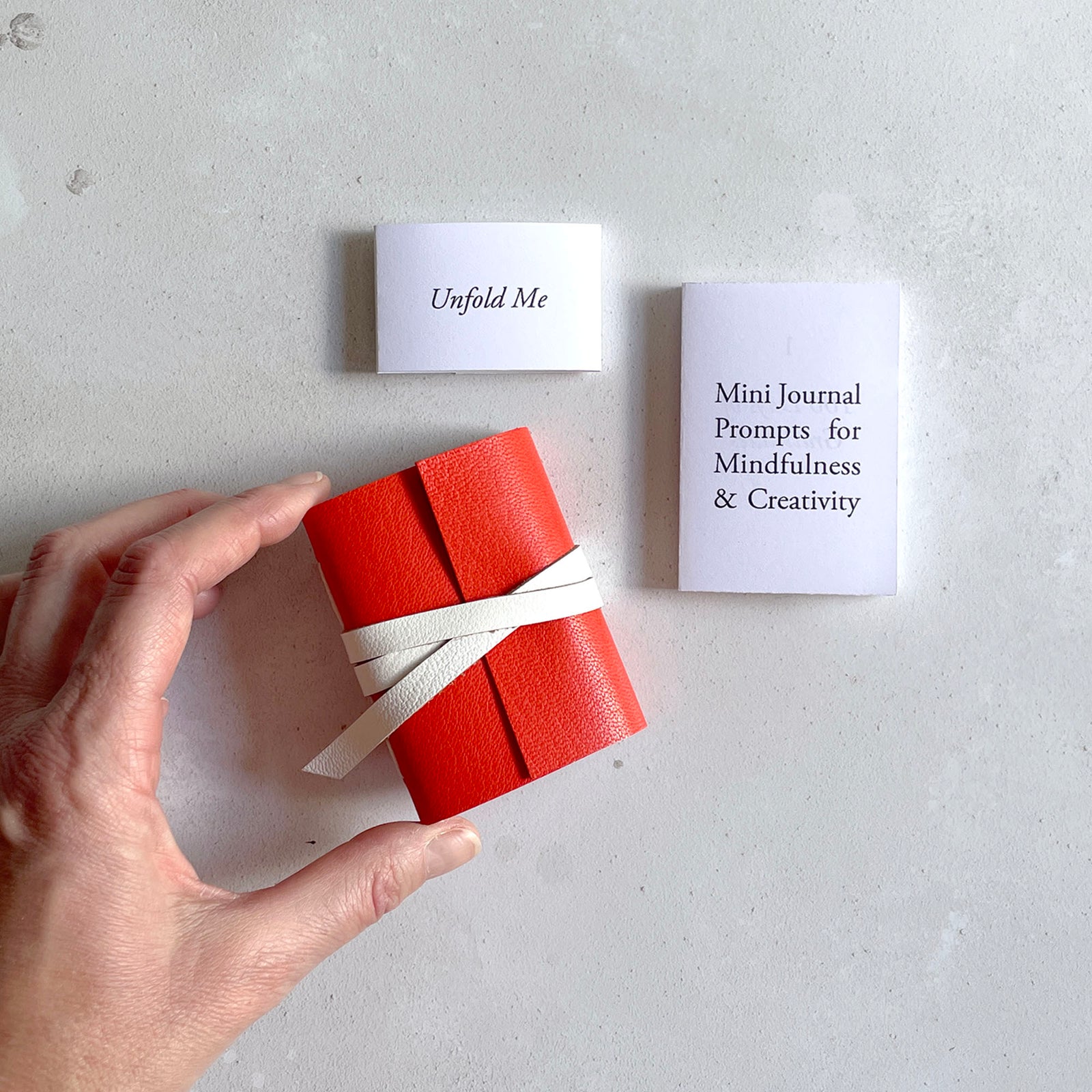 Mini Journal Prompts for Mindfulness and Creativity Artist's Book with handmade miniature journal in red and white leather