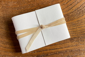 Wedding Guest Book handmade in white leather with velvet ribbon, A6 small.
