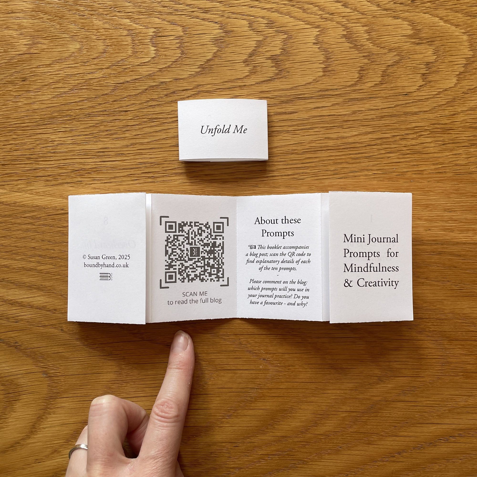 A QR code links to a blog post with full details of each of the 10 jouranling prompts with inspirational examples from artists, writers, coaches and psychologists.