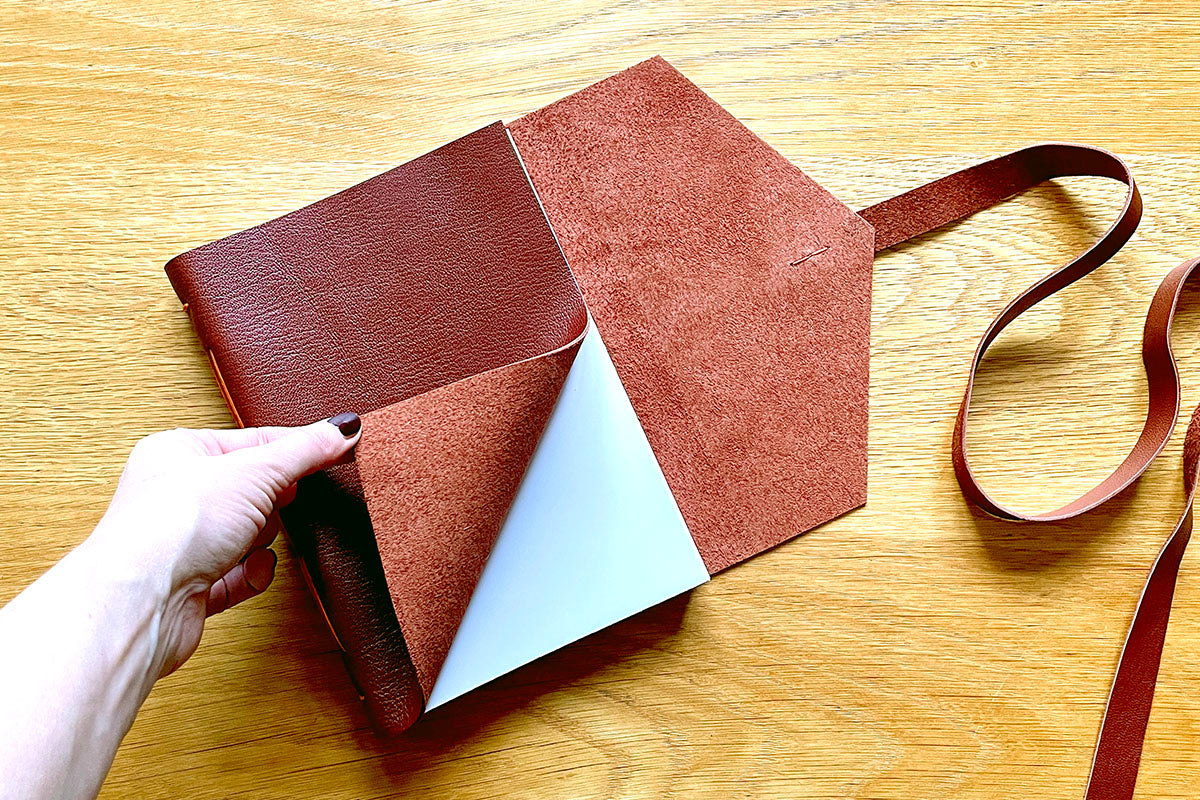 Luxury A5 leather notebook with tactile natural suede inner surface, bound by hand in Oxblood calfskin
