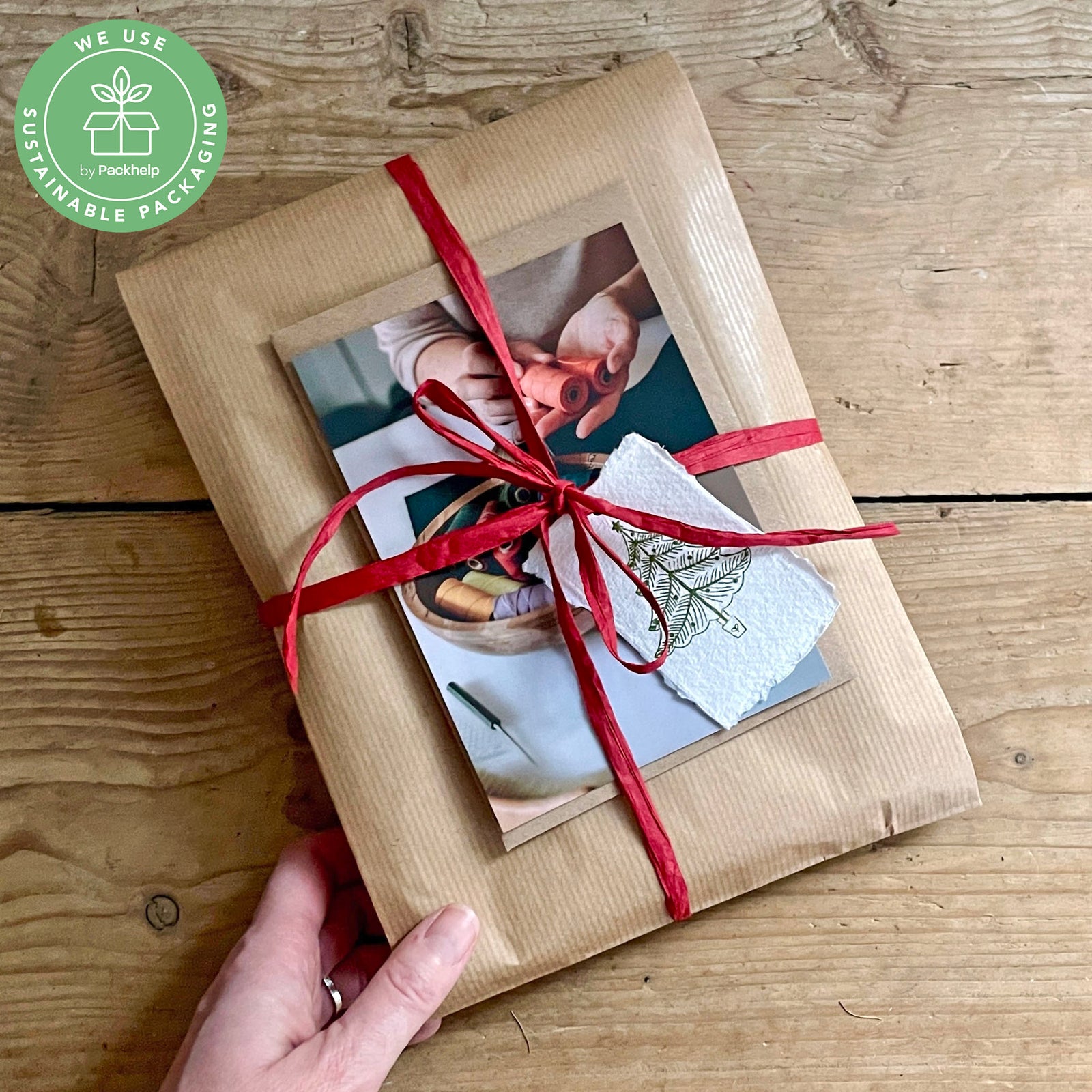 Christmas gift delivery of handmade books from bookbinder Susan Green at Bound by Hand. Sustainable packaging logo in top left corner.