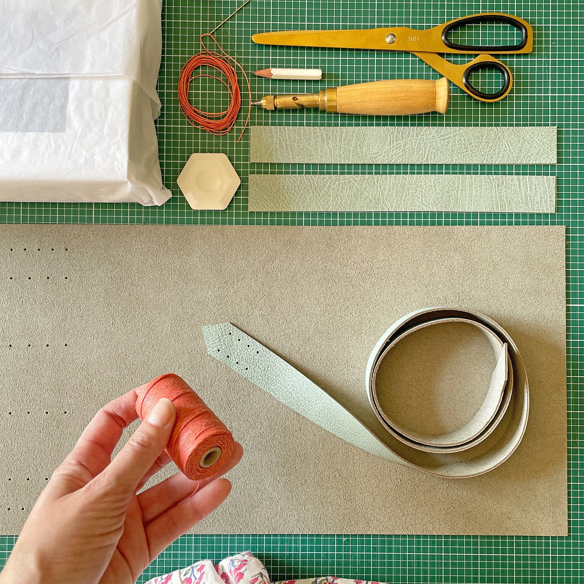 The softest Duck Egg leather and pretty Coral linen thread combine with heritage craftsmanship to make this Memory Book