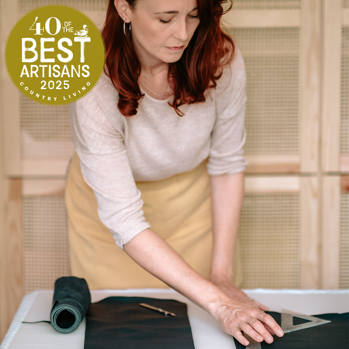 Bookbinder Susan Green with 40 best Artisans 2025 logo