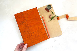Softcover vegan sketchbook bound by hand in recycled, sustainable natural materials.