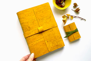 Cork Vegan Miniature Journal bound in Mustard Yellow and Forest Green, shown with full (A5) size matching journal.