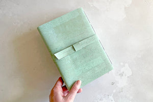 Back cover of Vegan Sketchbook in Mint Green cork textile. 