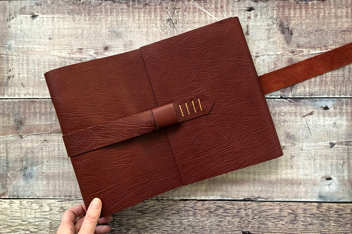 A4 large leather scrapbook bound by hand in Oxblood with Tan details