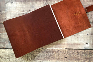 A softcover, lay flat leather book perfect as a family album, retirement collection or memories book