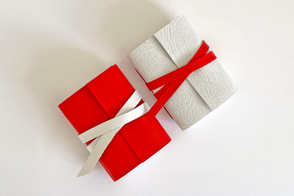 Pair of Miniature Journals bound in Red and White leathers