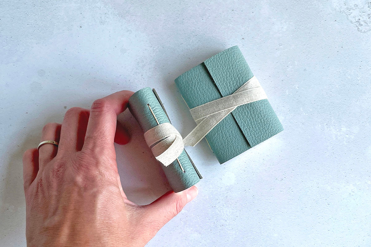 Miniature Journal bound in Duck Egg leather with natural linen ribbon.
