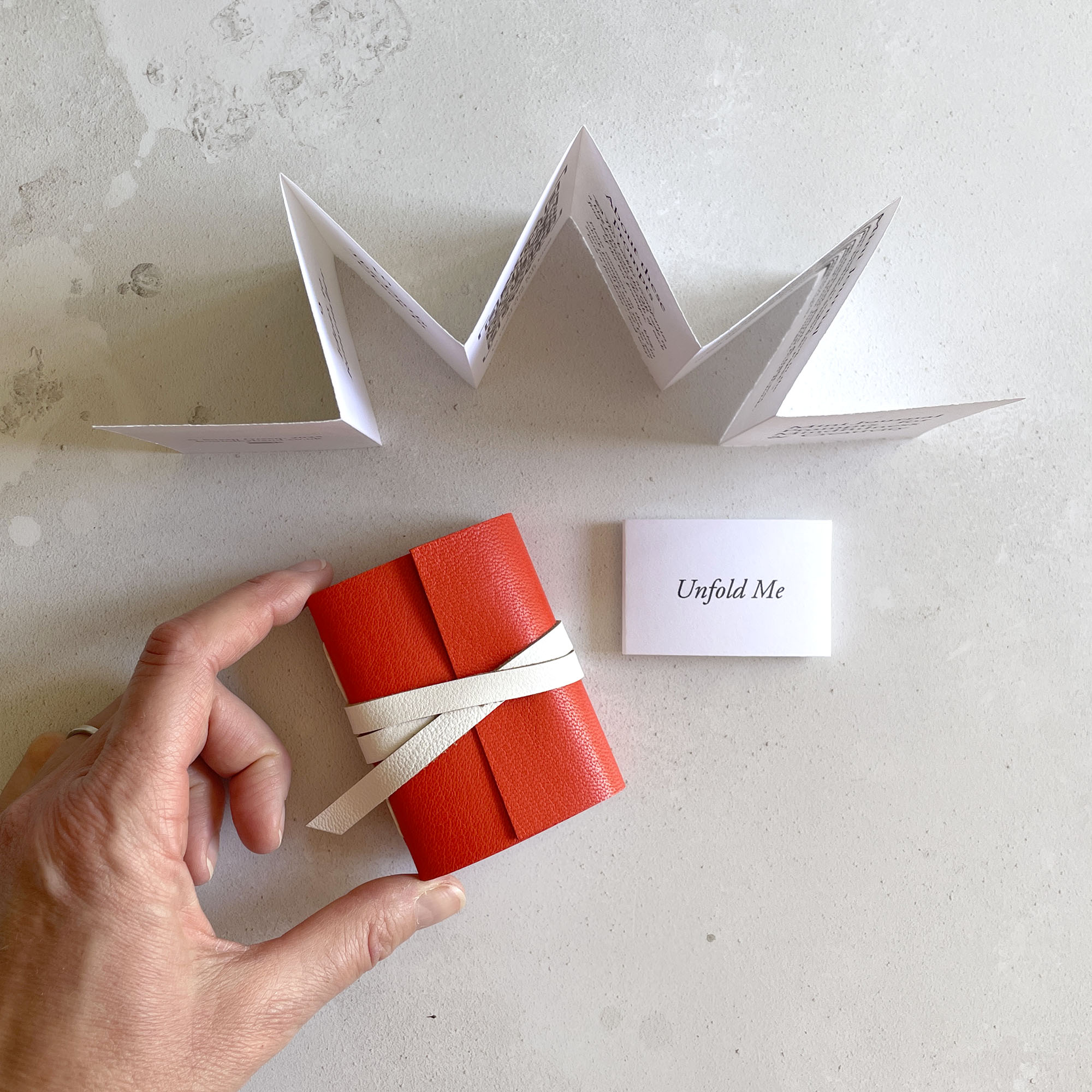Miniature Journal in red and white leather with leporello Artist's Book of writing and art daily prompts.