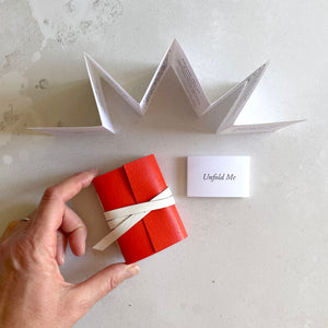 Miniature Journal in red and white leather with leporello Artist's Book of writing and art daily prompts.