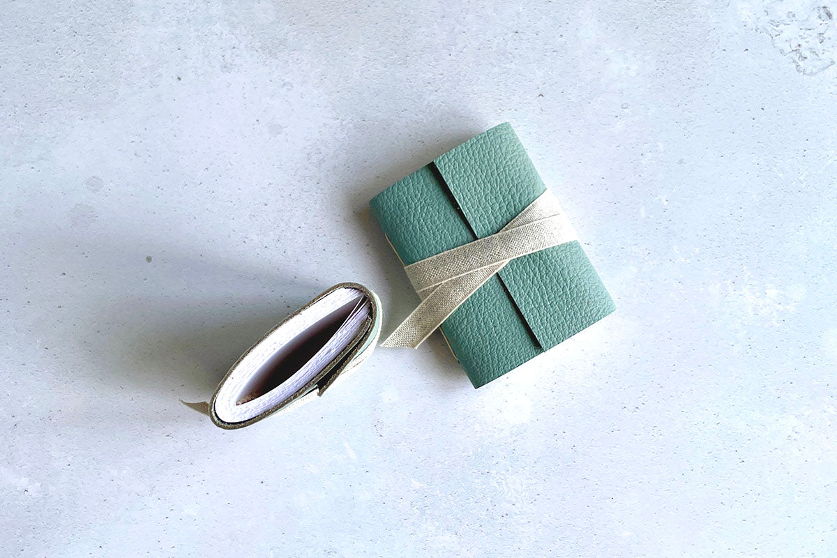 Miniature Journal bound in Duck Egg leather with natural linen ribbon.