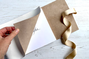 Romantic titlepage dedication in medium wedding guest book bound in white leather with silk ribbon