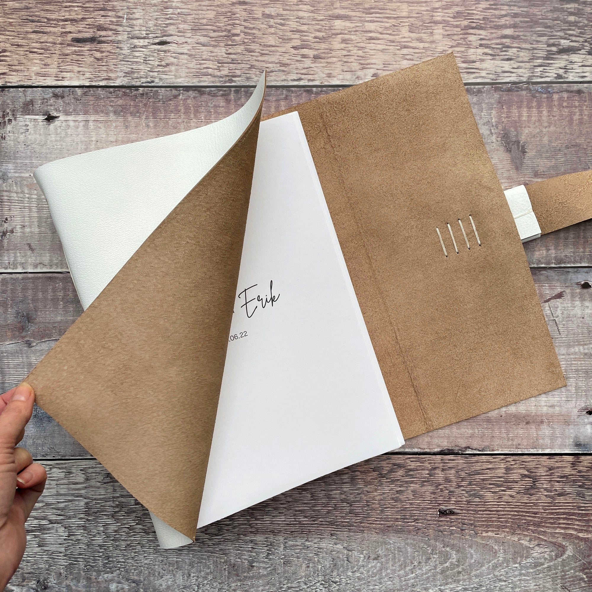 Leather Wedding Guest Book with bespoke personalised custom text printed on title page.