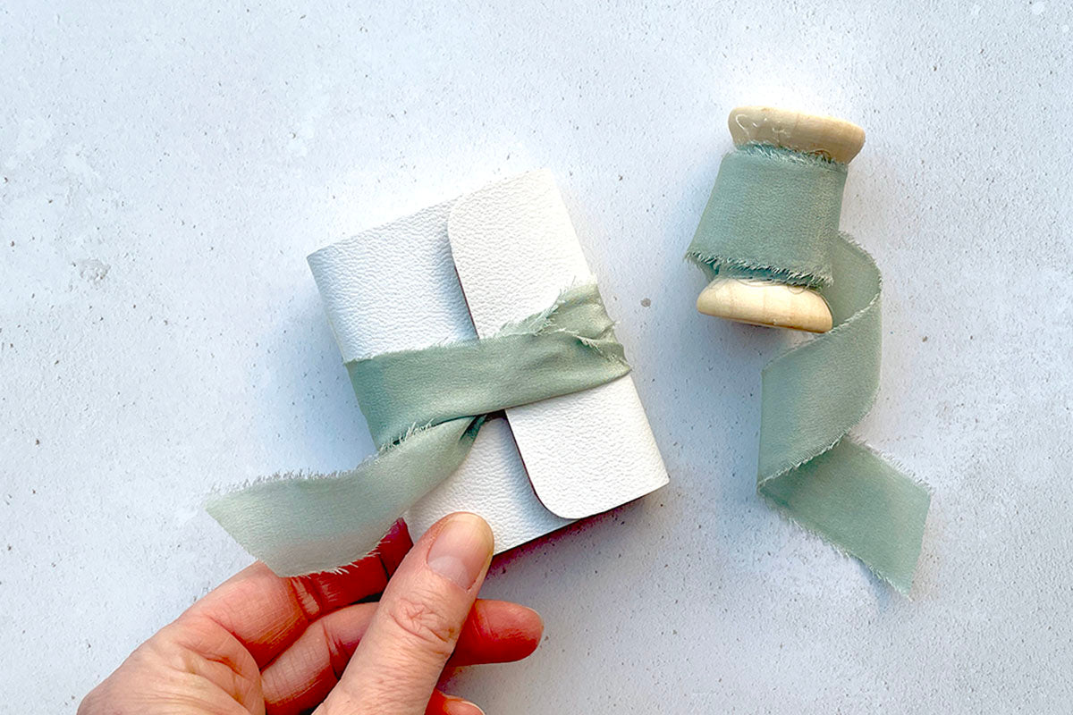 Miniature Journal bound in winter white leather paired with sea mist silk ribbon