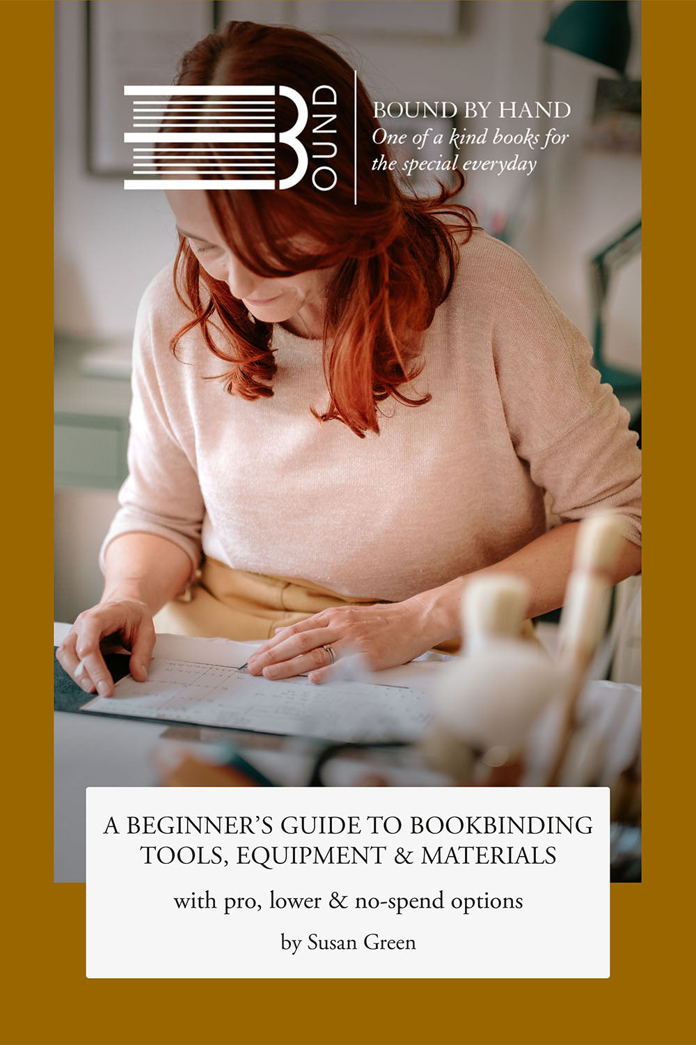 Black text on white background reads: a beginner's guide to bookbinding tools, equipment and materials. Behind is photography of read headed female bookbinder leaning over her workbench. The BOUND logo appears at the top in white. 