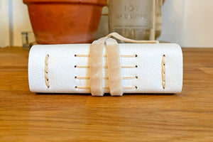 Lay flat Medieval binding Wedding Guest Book bound in white leather with Natural details in linen and velvet