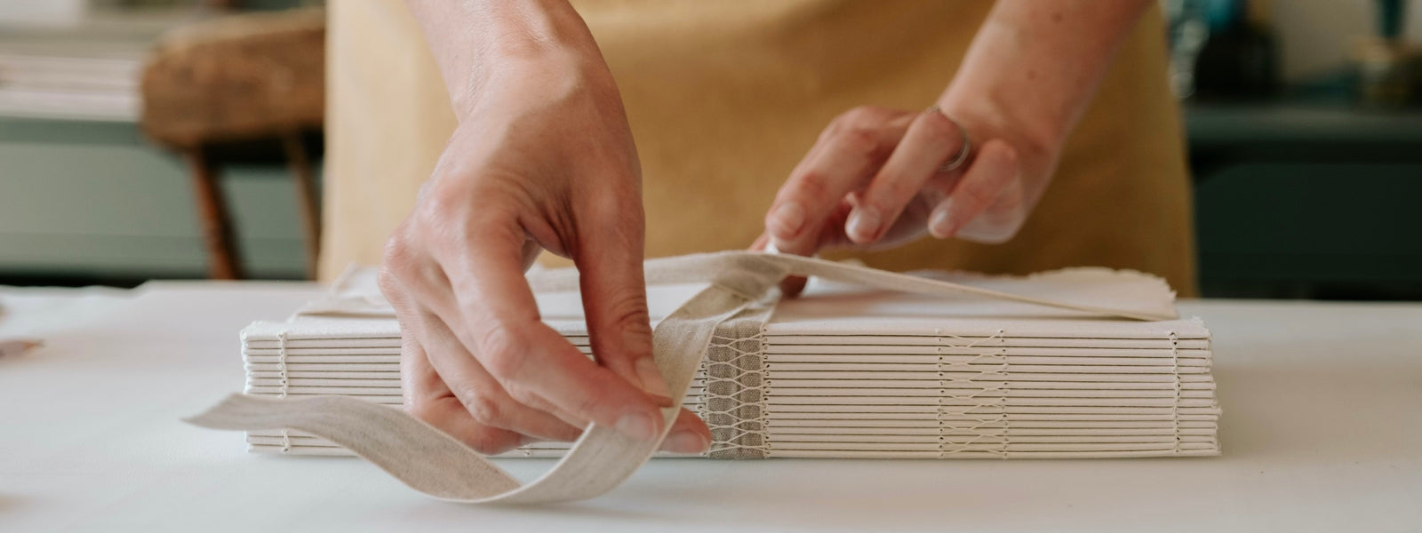 Cotton Rag Sketchbook bound with handmade cotton rag paper in exposed spine lay flat binding.