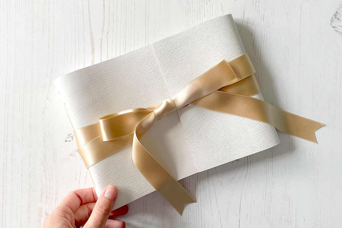 A5 medium landscape Wedding Guest Book: White leather and silk ribbon