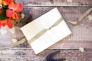 A5 Wedding Guest Book handmade in a rustic style with natural linen ribbon
