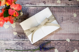 A6 small Wedding Guest Book bound in premium leather and natural linen ribbon.