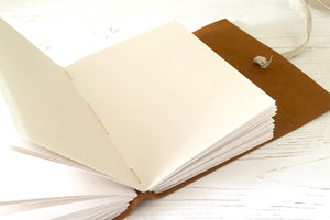 A6 Leather Sketchbook with recycled cartridge paper pages, bound by hand Longstitch style.