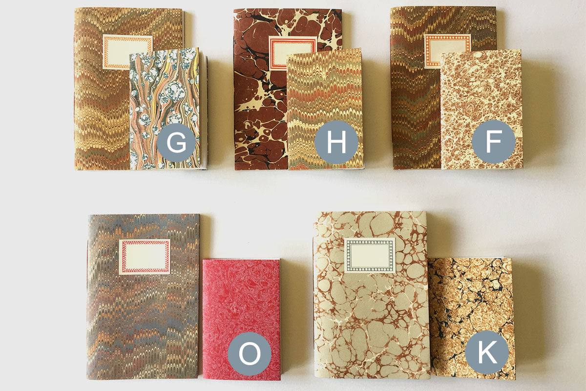 Variety of 'Small' Marbled Notebook Gift Sets: A6 and A7 paperback journals and slim jotters.