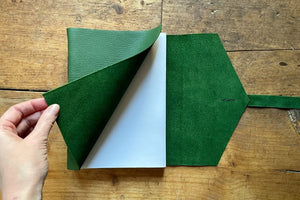 Turn back the softcover of this green sketchbook to reveal recycled cartridge pages