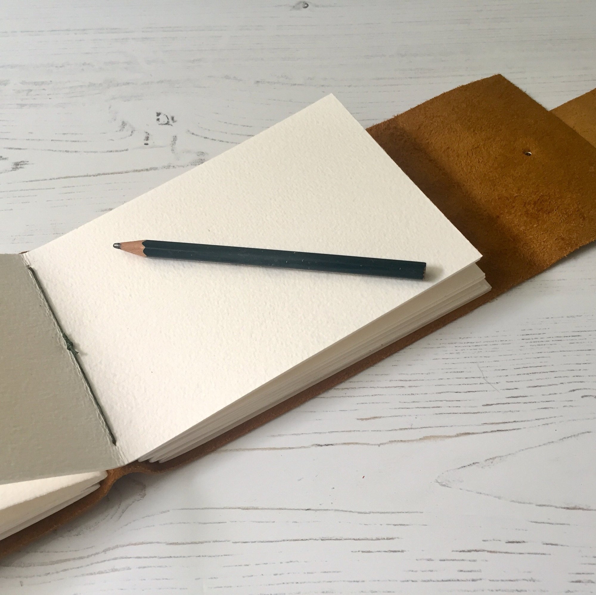 A6 Leather Sketchbook with 300gsm cold pressed Langton watercolour paper for artists.