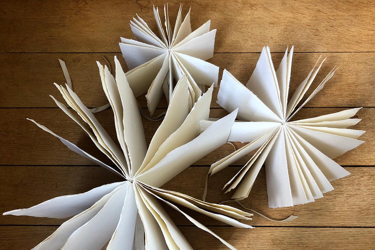 Wabi Sabi cotton rag sketchbooks turn 360 degrees in a circle for exhibition display